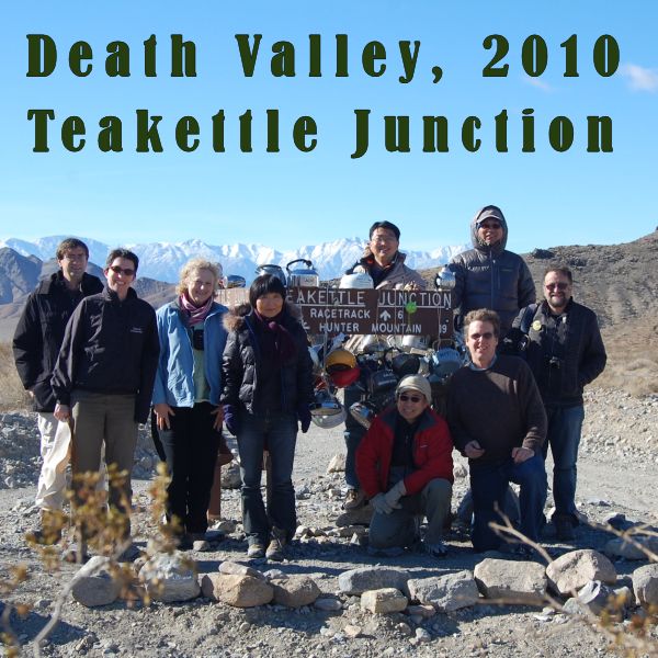 photo of 9 group members at Teakettle Junction in Death Valley